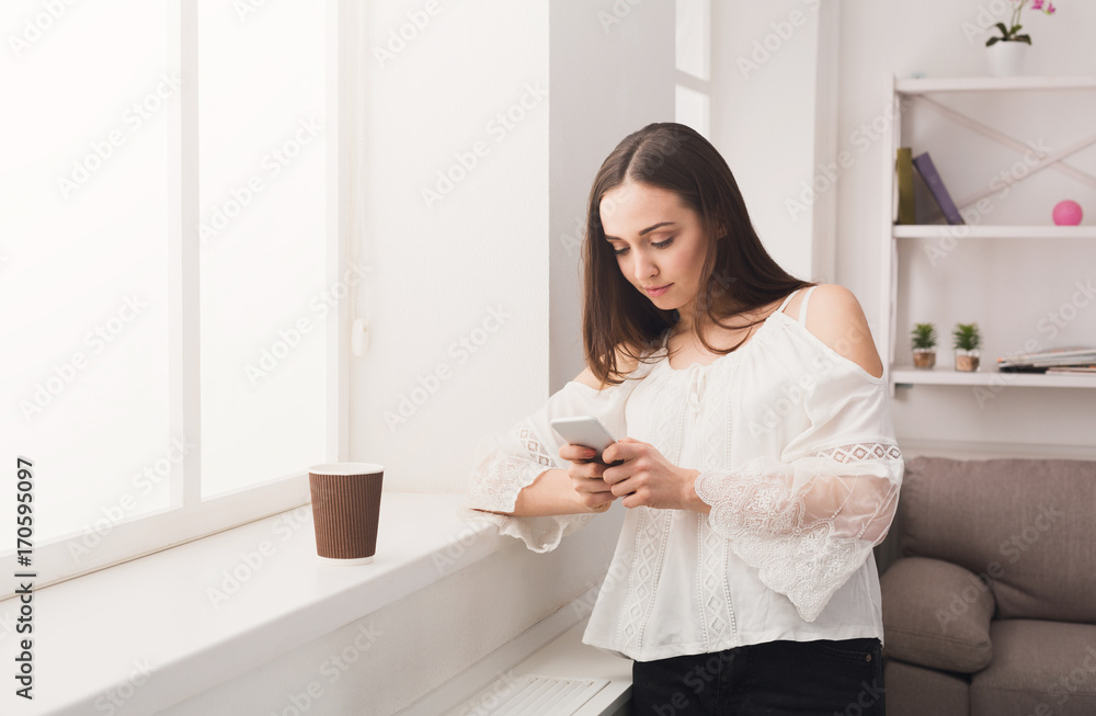 Online. Young woman messaging on mobile phone Online. Young woman messaging on mobile phone