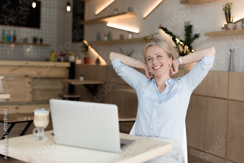 smiling woman with laptop