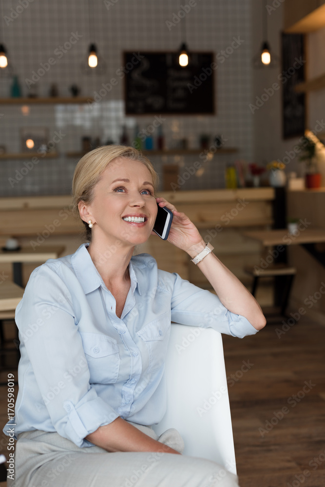 mature woman talking on smartphone mature woman talking on smartphone