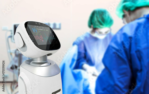 Robotic advisor service technology in healthcare smart hospital , artificial intelligence concept. Surgury Doctors in operating room and robot display status of patient.