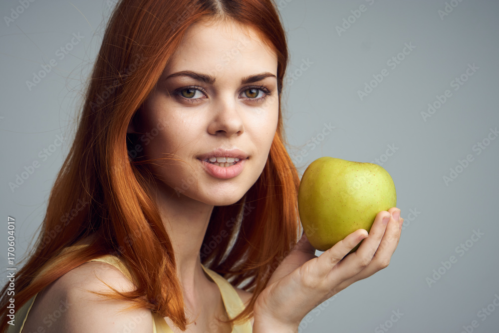 woman holding an apple, portrait, close-up woman holding an apple, portrait, close-up