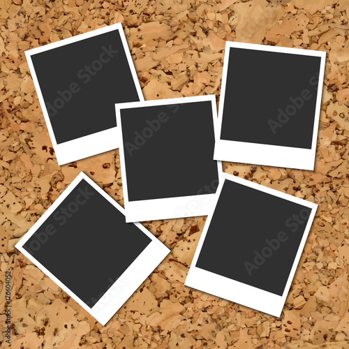 Cork board with scattered photo cards