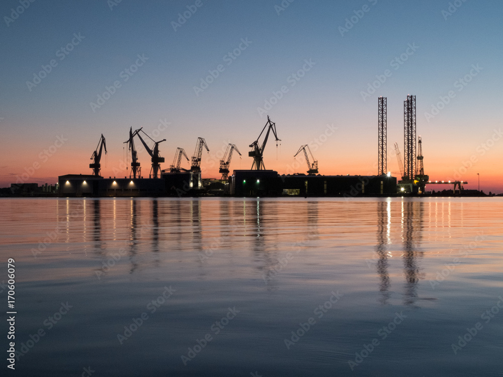 Shipyard on the sea at the sunset