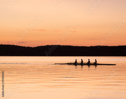 rowing on the sea at sunset © Marco