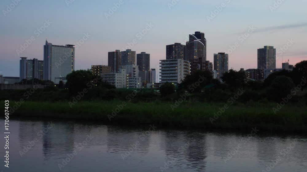 Evening river and cityscape - video 4K UHD Evening river and cityscape - video 4K UHD