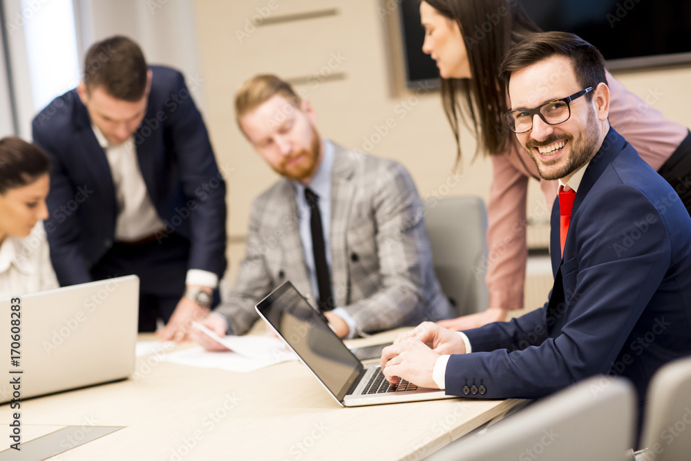 Fototapeta premium Young business people working together in office