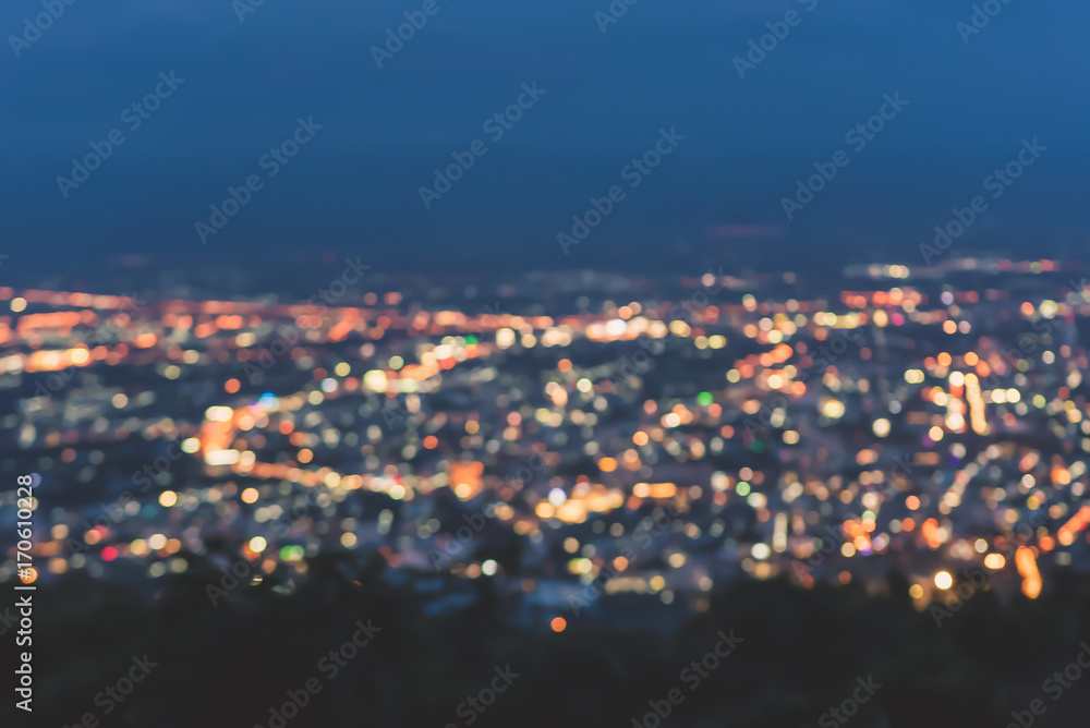 Naklejka premium Blur background city lights at night and blue sky