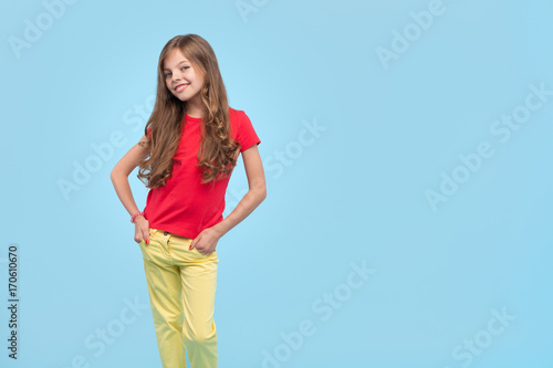 Trendy confident girl on blue background