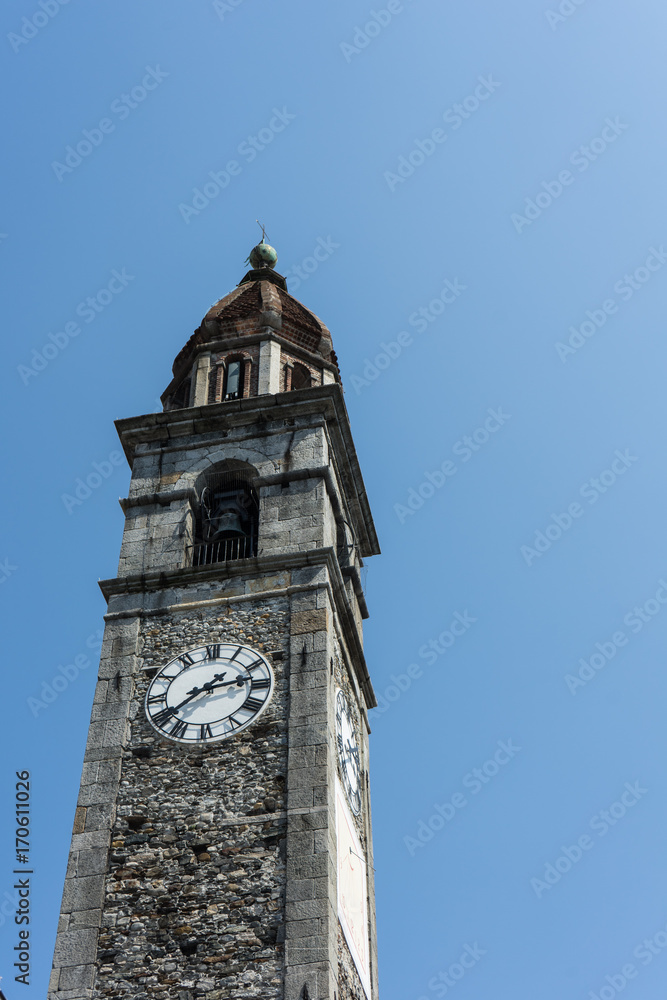 Clock tower of Chiesa Parrocchiale dei Santi Pietro e Paolo at center square in Ascona, Locarno, Switzerland