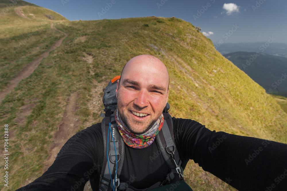 Hiker taking a selfie while out trekking Hiker taking a selfie while out trekking