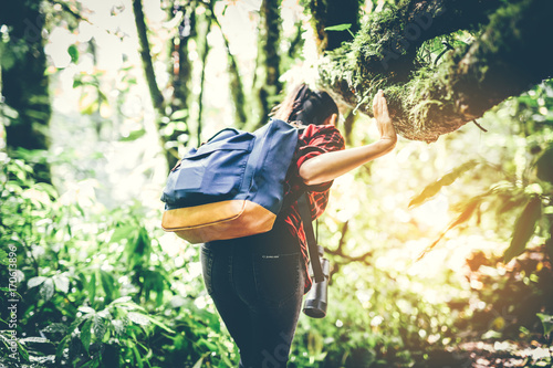 woman traveler with backpack hiking in young hiking holiday.adventure, travel, tourism,