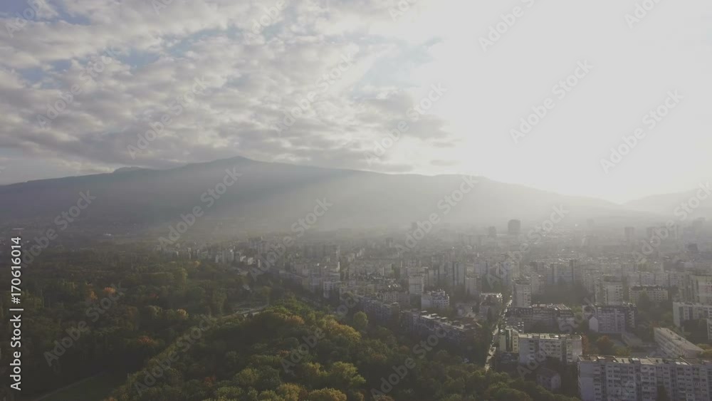Misty mountain urban landscape from air Misty mountain urban landscape from air