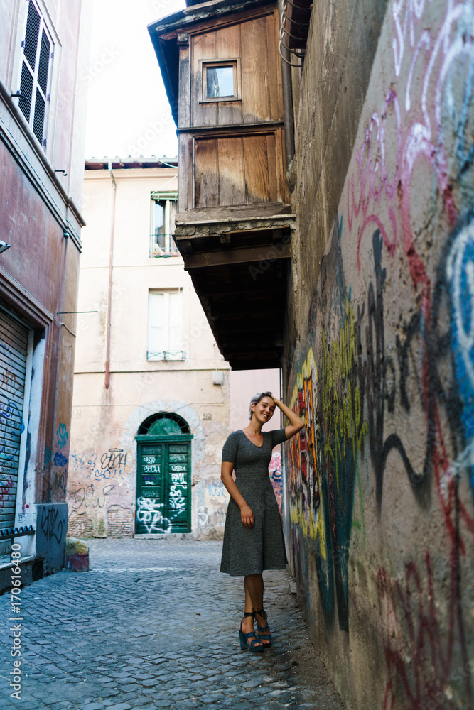 Smiling woman in alley