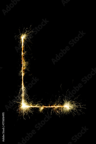 English alphabet from sparkler on black background,Alphabet big letter photo