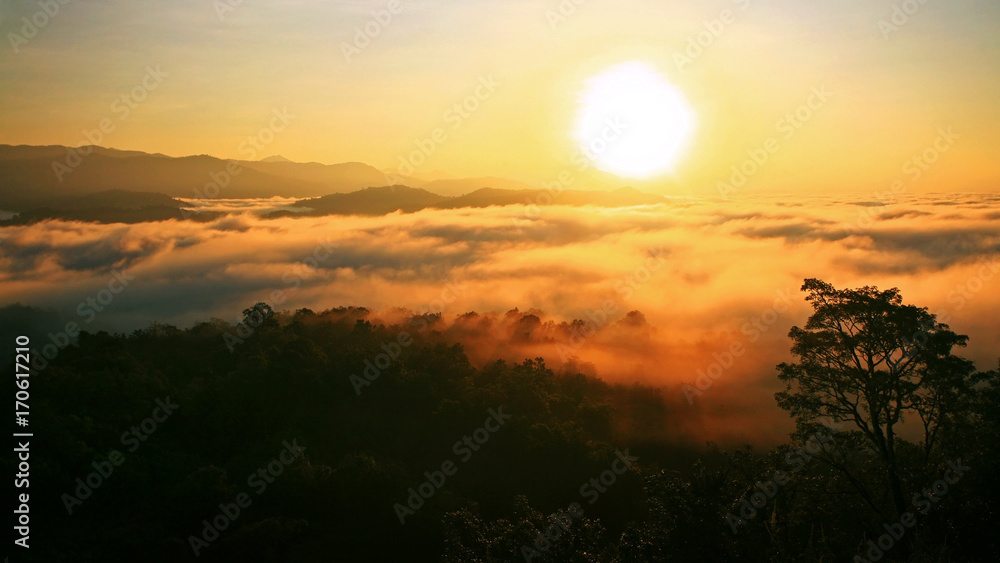 Sunrise over mountain and fog Sunrise over mountain and fog