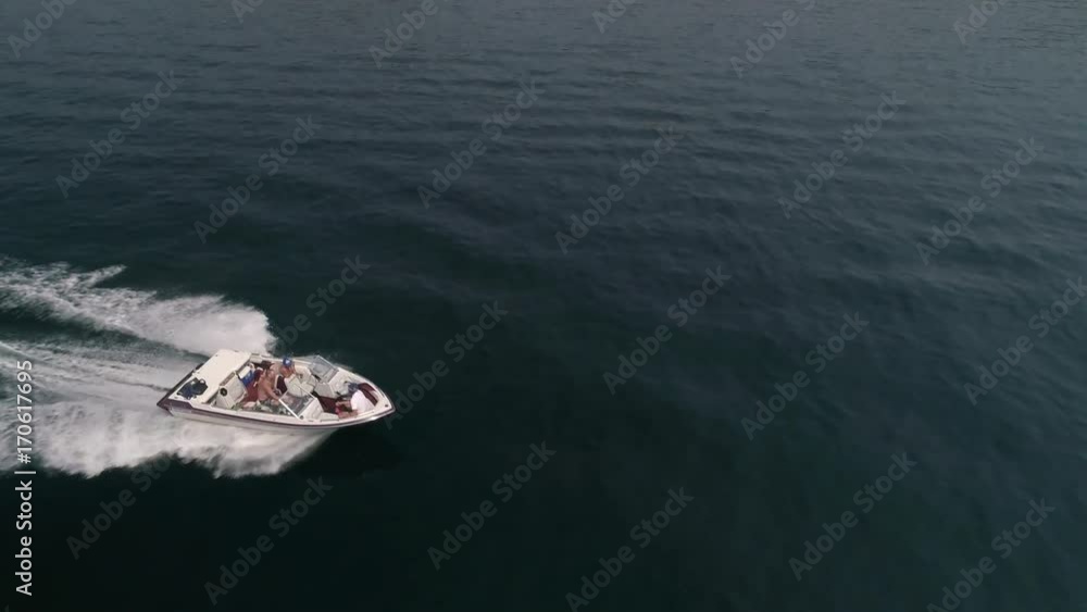 Aerial Above Boat Passing on Sunny Summer Day in Boating Season Aerial Above Boat Passing on Sunny Summer Day in Boating Season