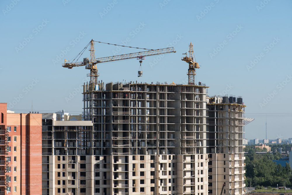Column cranes building new monolith building in Dolgoprudny, Russia Column cranes building new monolith building in Dolgoprudny, Russia