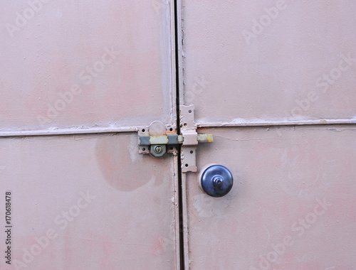 Closed metal door with safety lock © joserpizarro