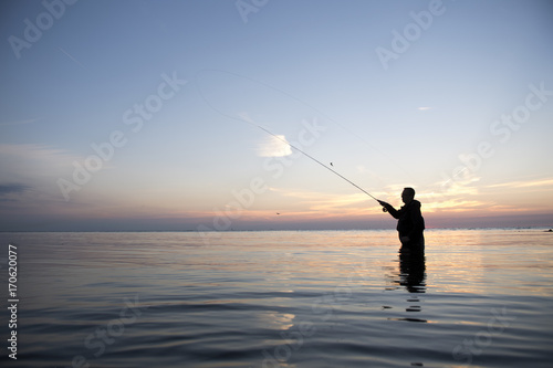 flyfishing man at dawn