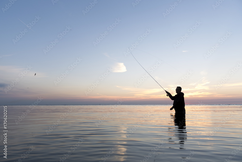 flyfishing man at dawn