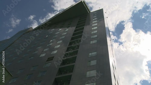 High rise building and clouds floating in the sky photo