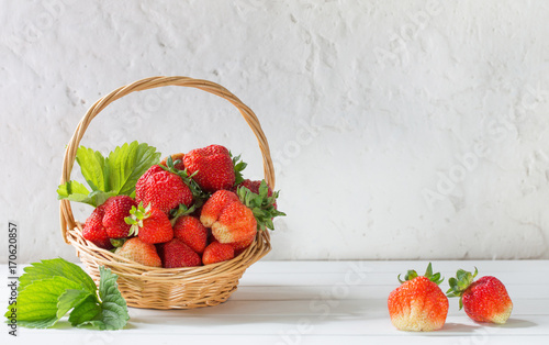 strawberries in basket on white background