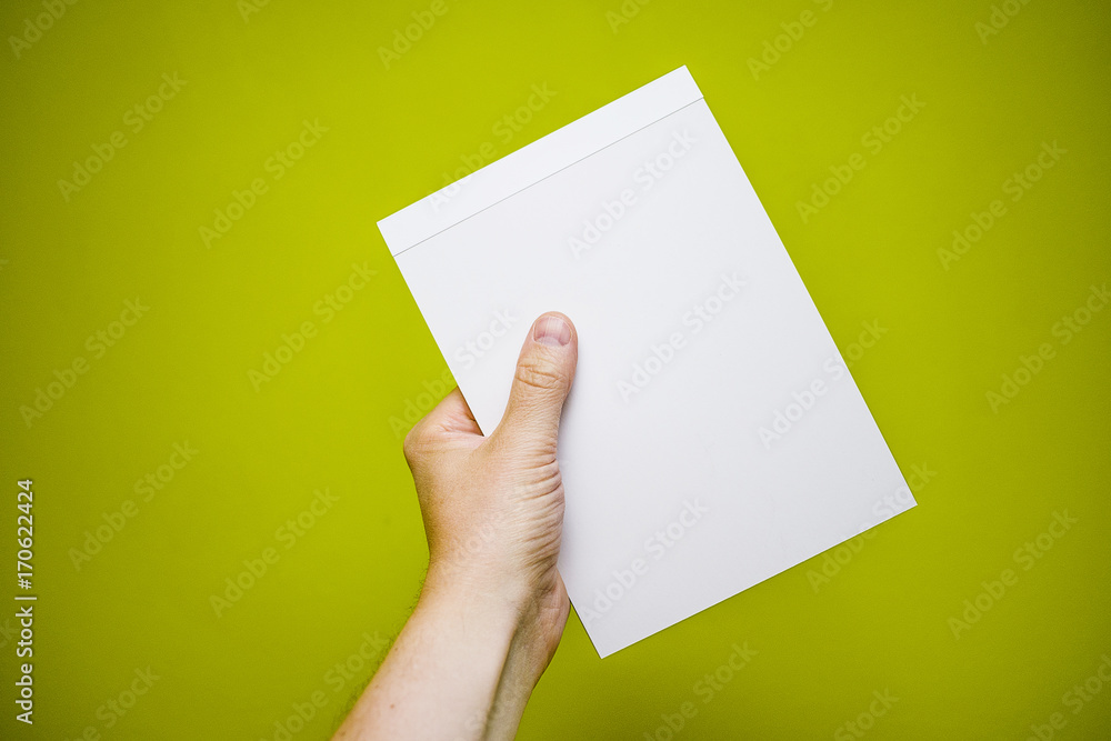 Fototapeta premium Ręka z notatnikiem