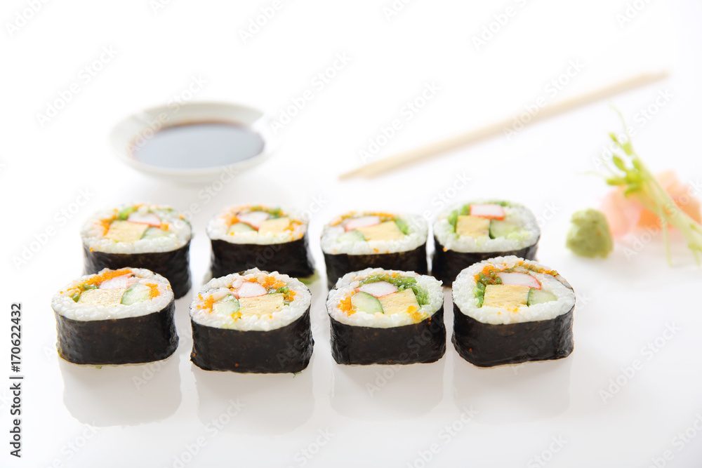 Futomaki sushi , Japanese roll rice egg avocado cucumber and caviar isolated in white background Futomaki sushi , Japanese roll rice egg avocado cucumber and caviar isolated in white background