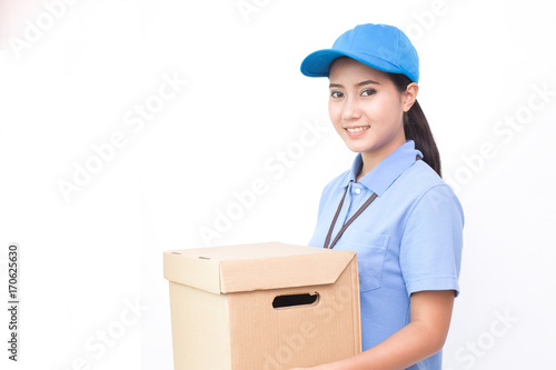 Young Asian Woman with Delivery service worker in uniform. Woman holding Box with attractive  smiling isolated on white background. © Bavorndej