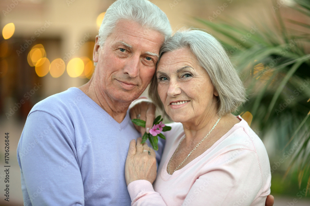 couple hugging at resort couple hugging at resort