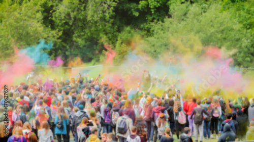 Celebrants dancing during the color Holi Festival. Holi festival with colorful hands, vivid powder, selective focus