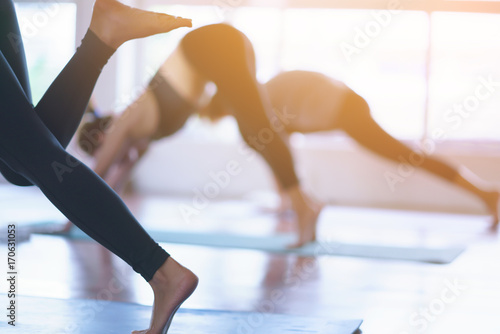 Women exercising in fitness studio yoga classes