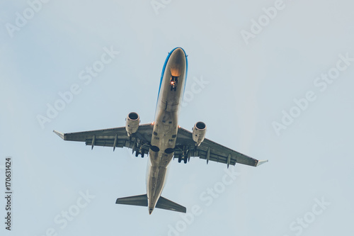 Fotografie airplane from beneath , aircraft flying from below