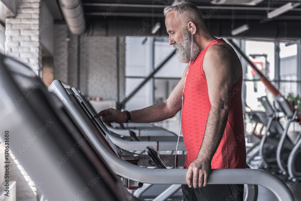 Pleasant bearded male is enjoying sport Pleasant bearded male is enjoying sport