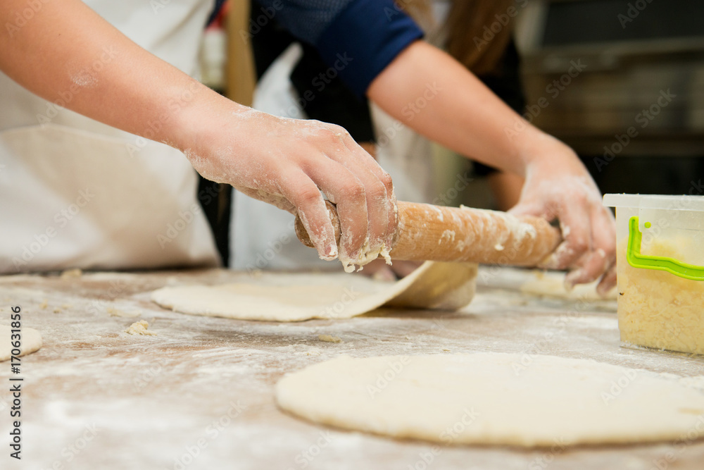 Manufacture of dough products. Hands closeup