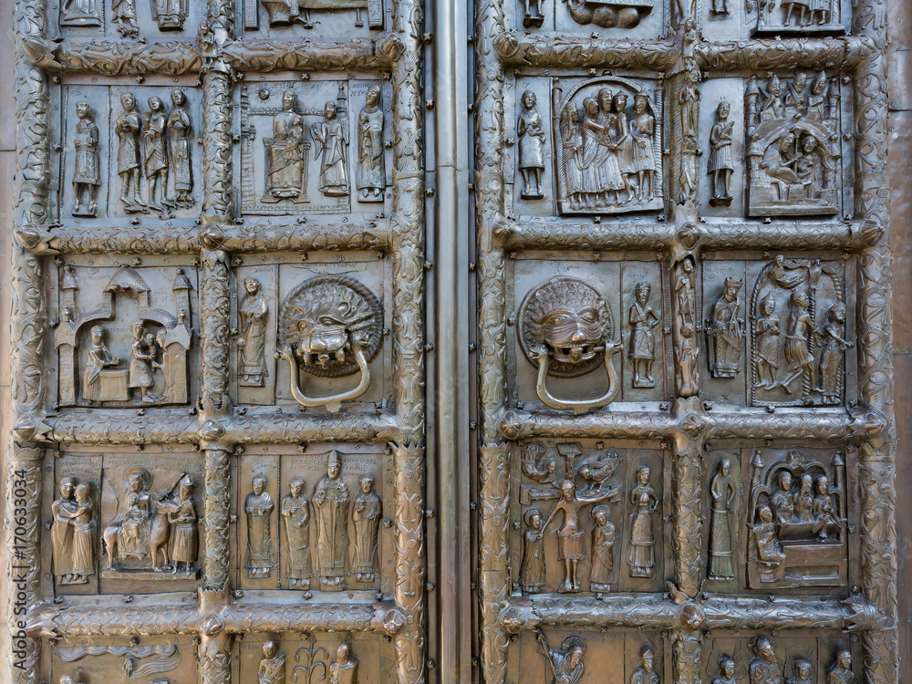 Detail of the ancient bronze Magdeburg Gates of St. Sophia Cathedral in Veliky Novgorod, Russia, 1153 year Detail of the ancient bronze Magdeburg Gates of St. Sophia Cathedral in Veliky Novgorod, Russia, 1153 year