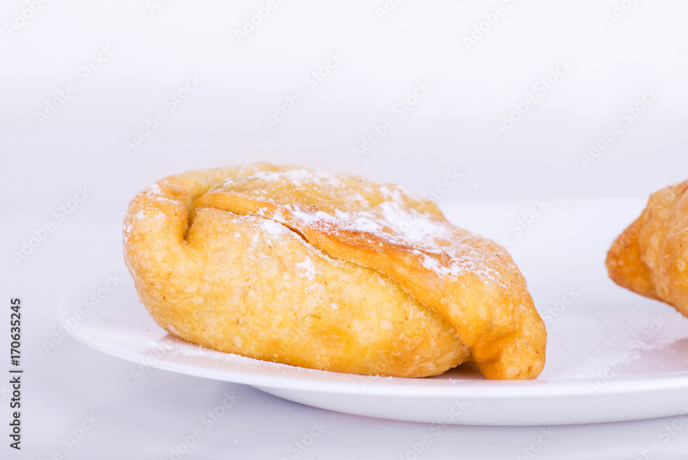 sweet samosa on a white plate sweet samosa on a white plate