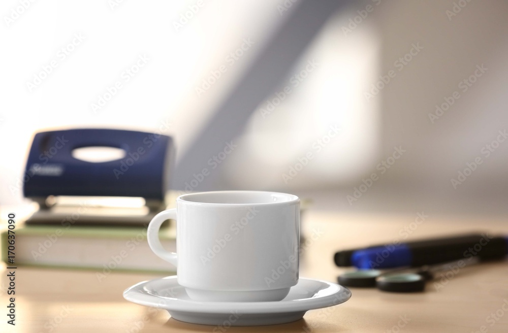 White cup on office table