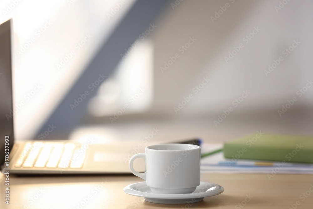 White cup on office table