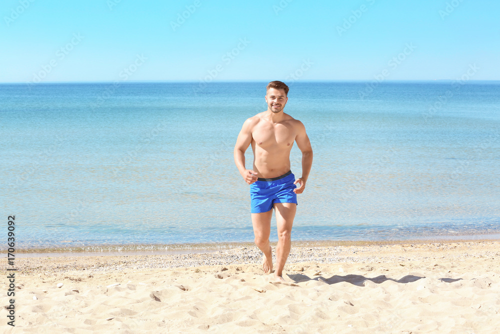Handsome young man on sea beach Handsome young man on sea beach