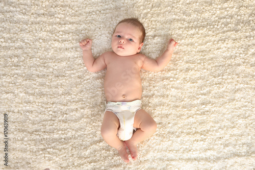 Cute little baby lying on s...