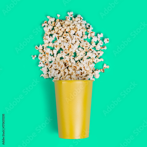 Popcorn on a turquoise background. Minimal art.