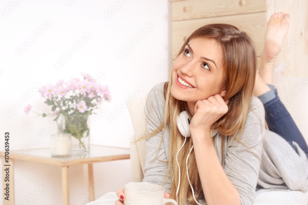 Portrait of a dreaming woman posing while lying on a sofa Portrait of a dreaming woman posing while lying on a sofa