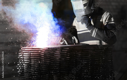 Specialist performing welding in workshop