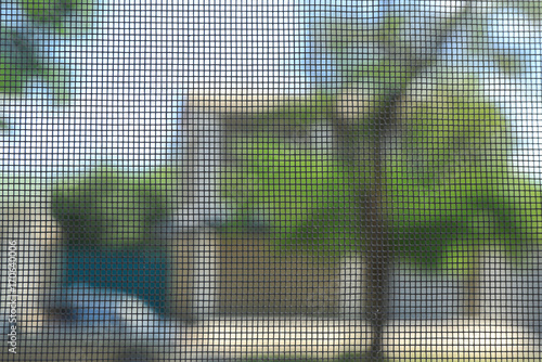 View of street through window screen, close up