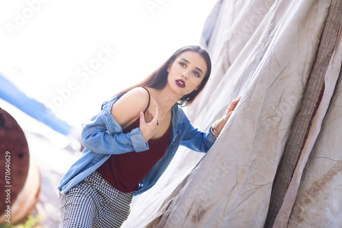Fashionable young woman out...