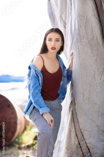 Fashionable young woman out...