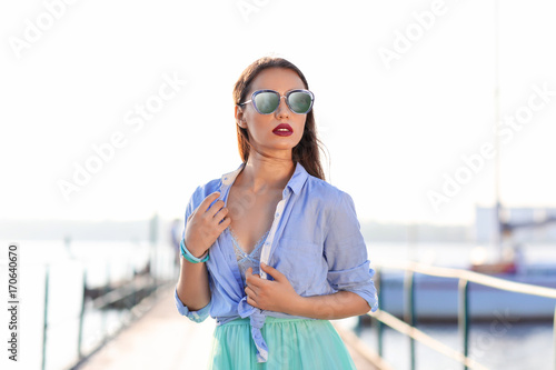 Fashionable young woman on ...