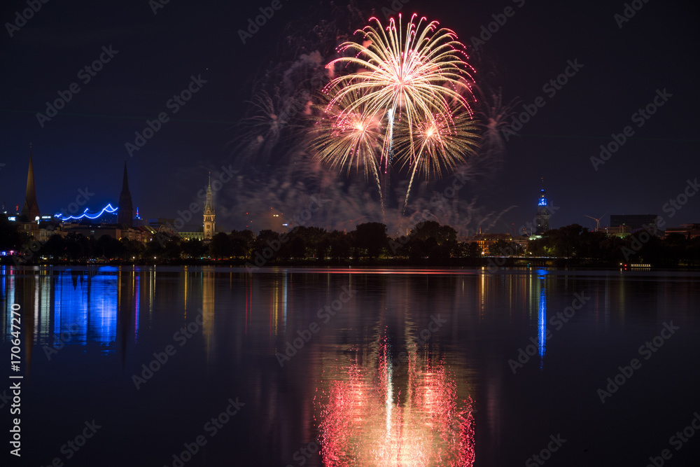 nightly panorama of Hamburg - Inner City with firework over the lake Alster