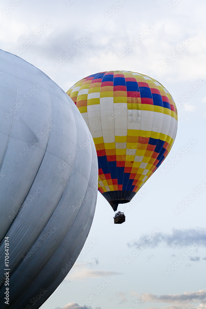 Obraz premium Two hot air balloons up in the sky